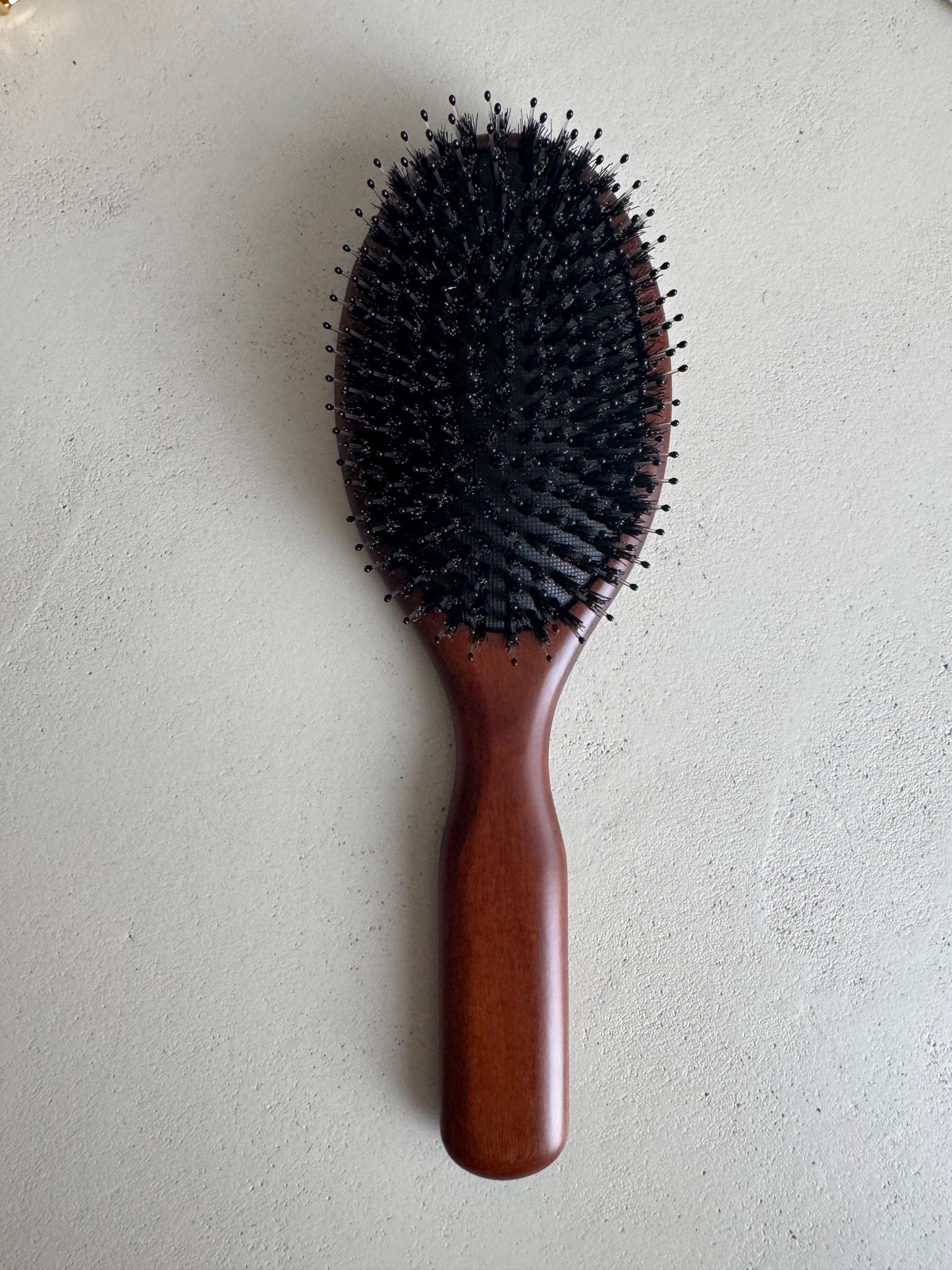 Wooden boar bristle brush