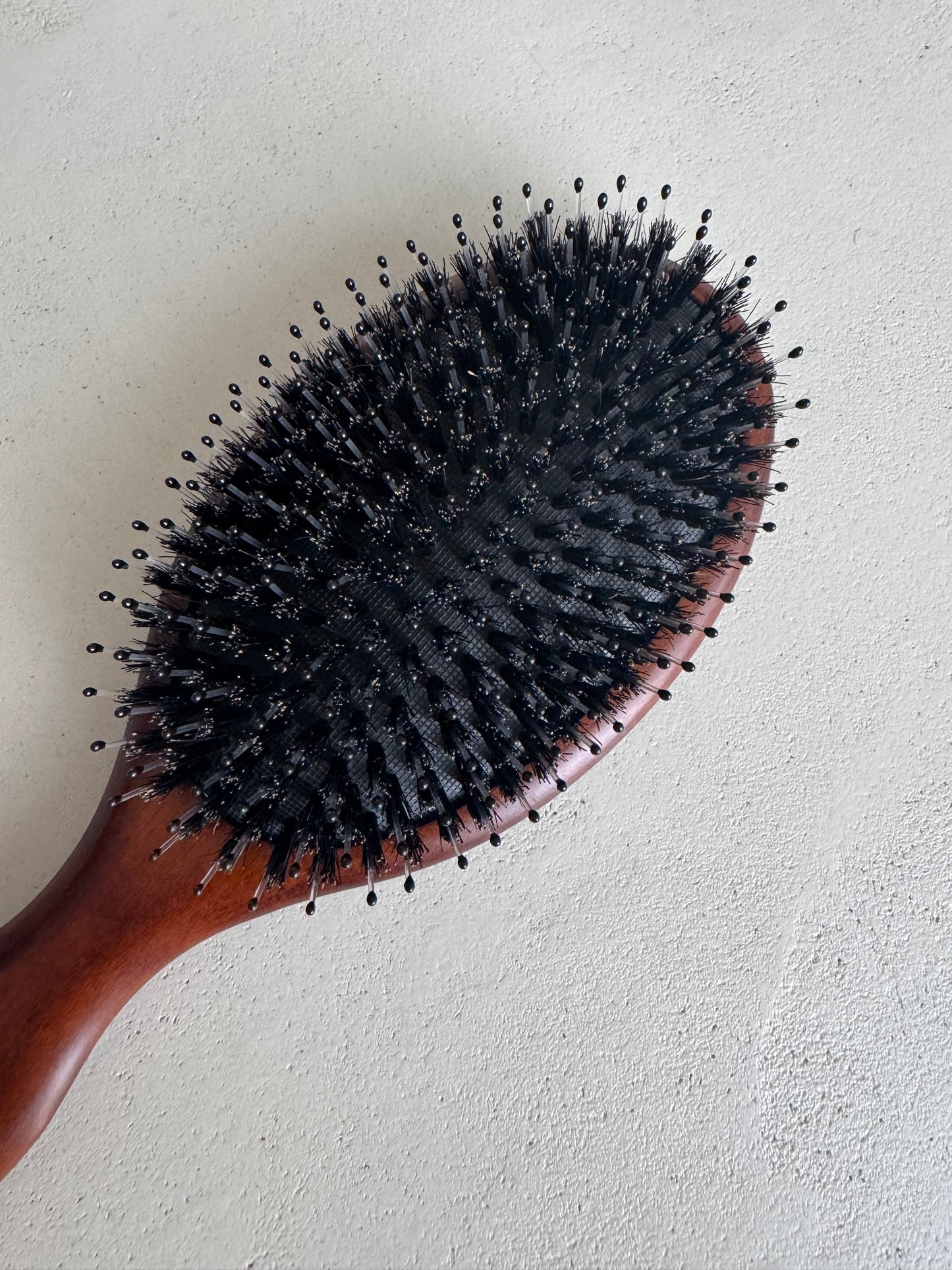 Wooden boar bristle brush